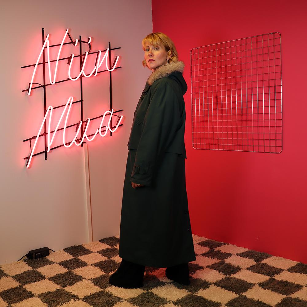 pitkä vihreä takki